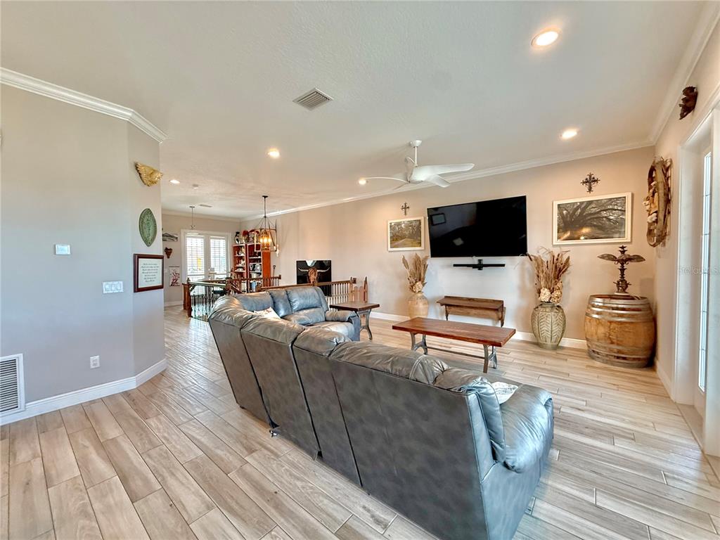 2569 Palm Avenue Flagler Beach, FL 32136 - Photo 21 of 69 a living room with furniture and a flat screen tv
