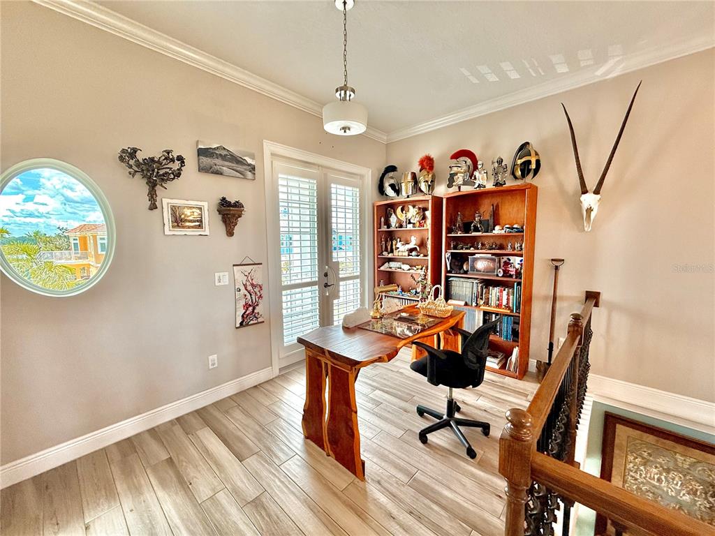 2569 Palm Avenue Flagler Beach, FL 32136 - Photo 22 of 69 a view of a workspace with furniture and a window