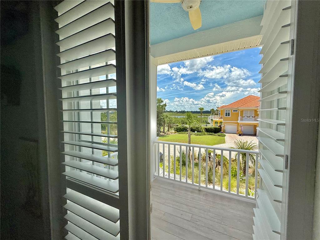 2569 Palm Avenue Flagler Beach, FL 32136 - Photo 23 of 69 a view of a glass door and from a window