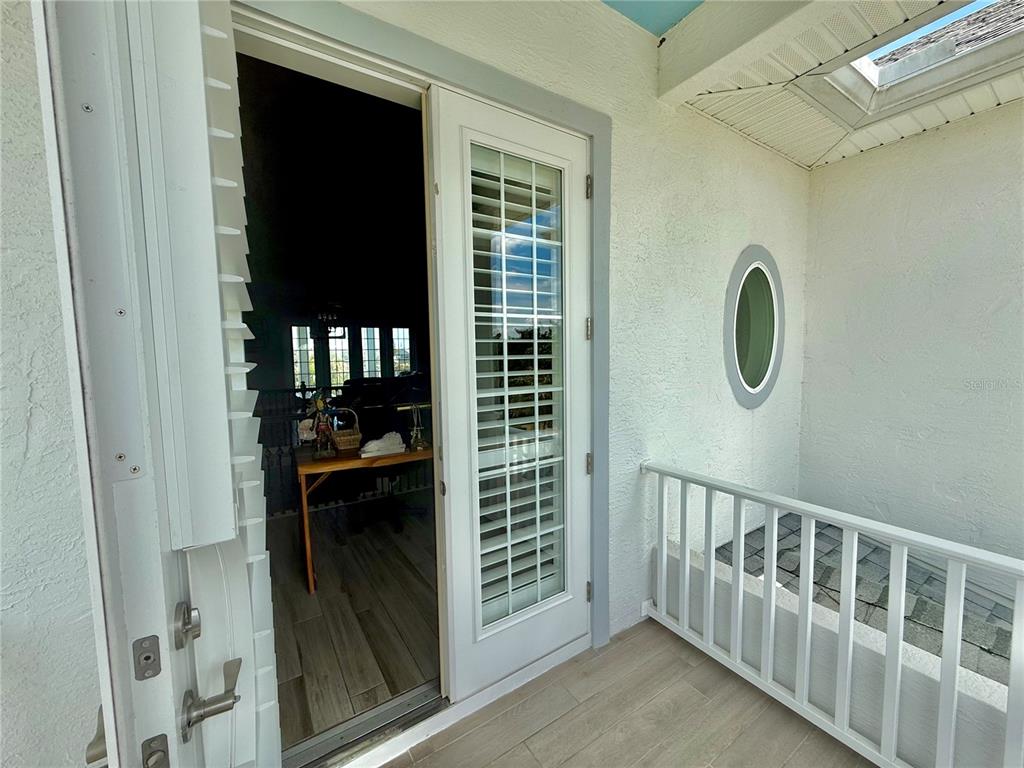 2569 Palm Avenue Flagler Beach, FL 32136 - Photo 25 of 69 a view of a wooden door and a window