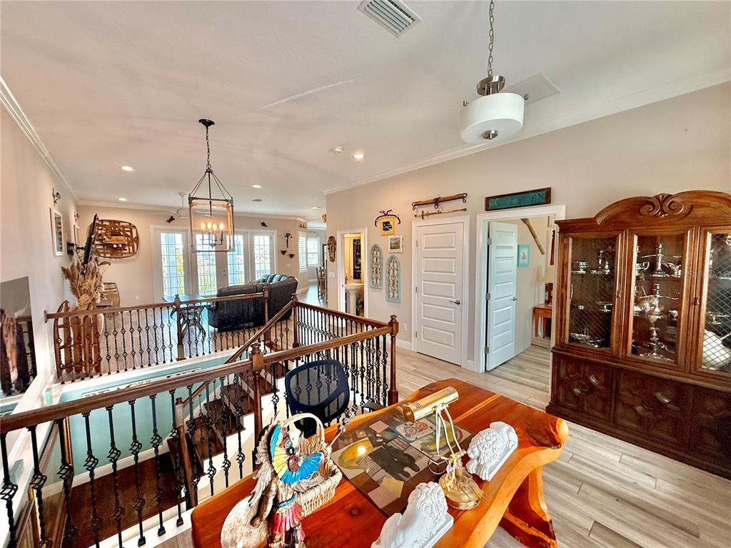 2569 Palm Avenue Flagler Beach, FL 32136 - Photo 26 of 69 a bedroom with furniture and a wooden floor