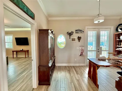 a large bathroom with a granite countertop sink a toilet a mirror and shower