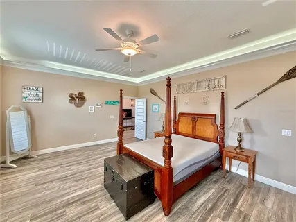 a living room with lots of furniture and wooden floor