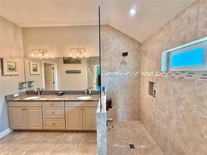 a view of a dining room with furniture large window and wooden floor