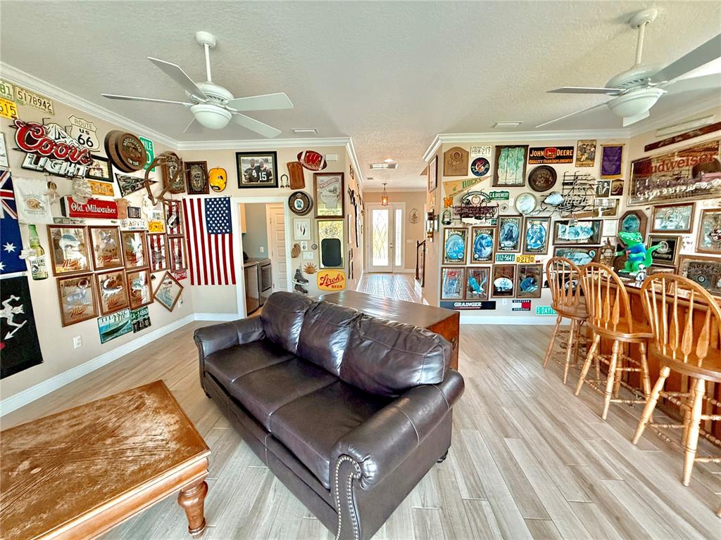 2569 Palm Avenue Flagler Beach, FL 32136 - Photo 38 of 69 a living room with lots of furniture and wooden floor