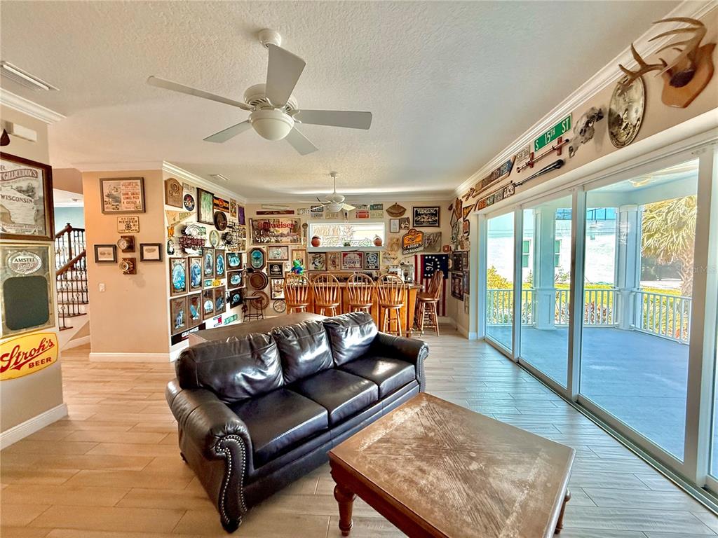 2569 Palm Avenue Flagler Beach, FL 32136 - Photo 39 of 69 a living room with furniture and a floor to ceiling window