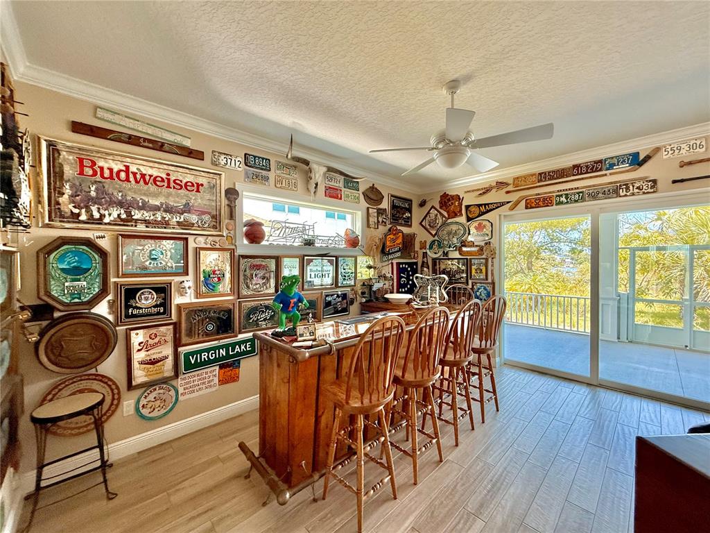 2569 Palm Avenue Flagler Beach, FL 32136 - Photo 40 of 69 a view of a dining room with furniture large window and wooden floor
