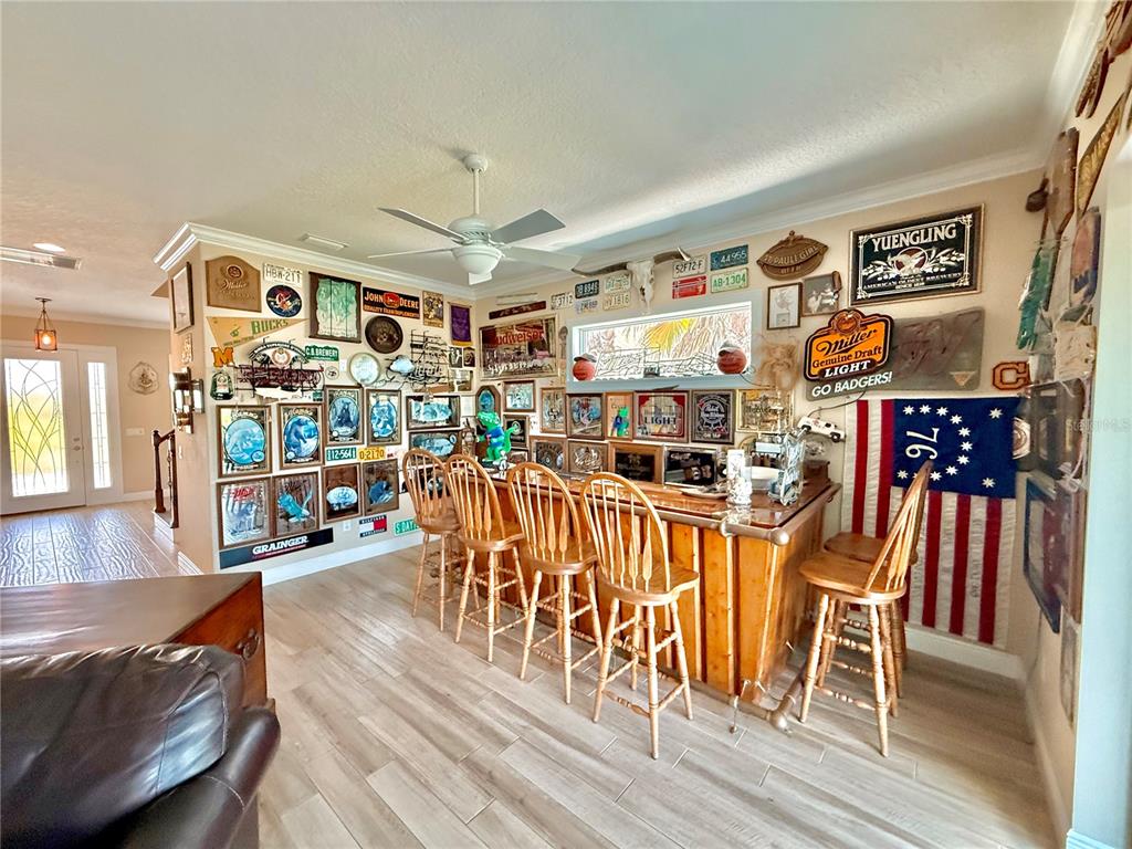 2569 Palm Avenue Flagler Beach, FL 32136 - Photo 41 of 69 a living room with lots of furniture and wooden floor