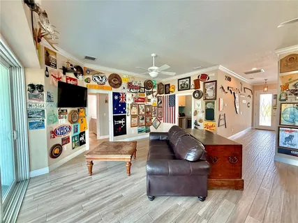 a kitchen with stainless steel appliances granite countertop a dishwasher a stove and a microwave oven with wooden floor