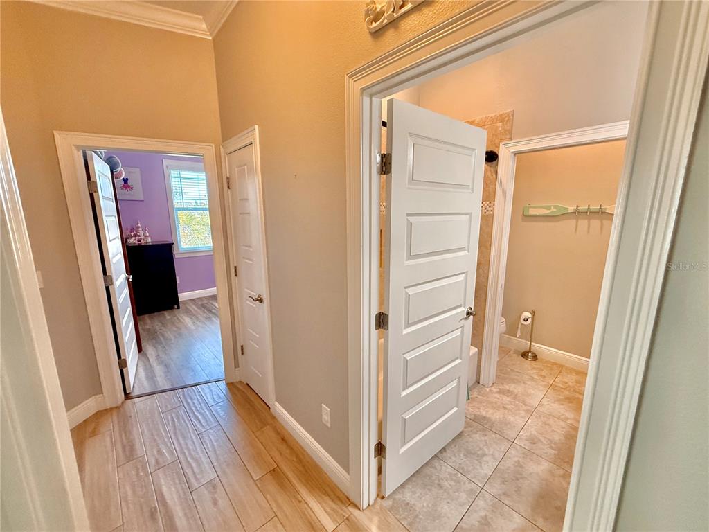 2569 Palm Avenue Flagler Beach, FL 32136 - Photo 49 of 69 a view of a hallway with wooden floor and closet