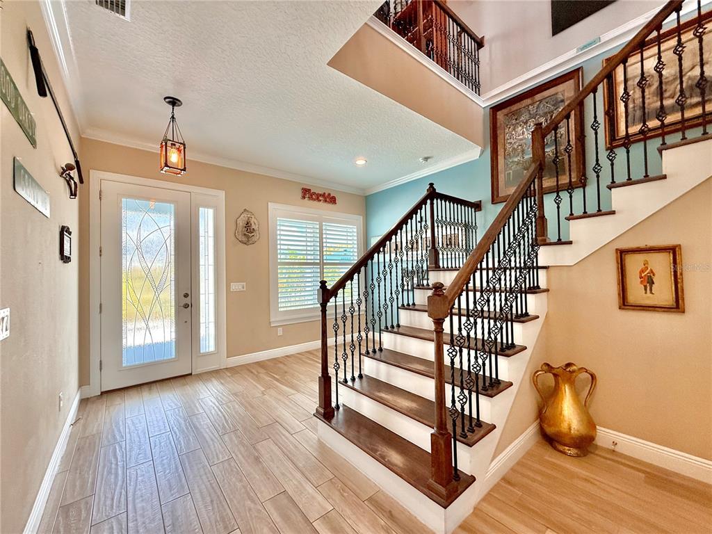 2569 Palm Avenue Flagler Beach, FL 32136 - Photo 5 of 69 a view of entryway and hall with wooden floor