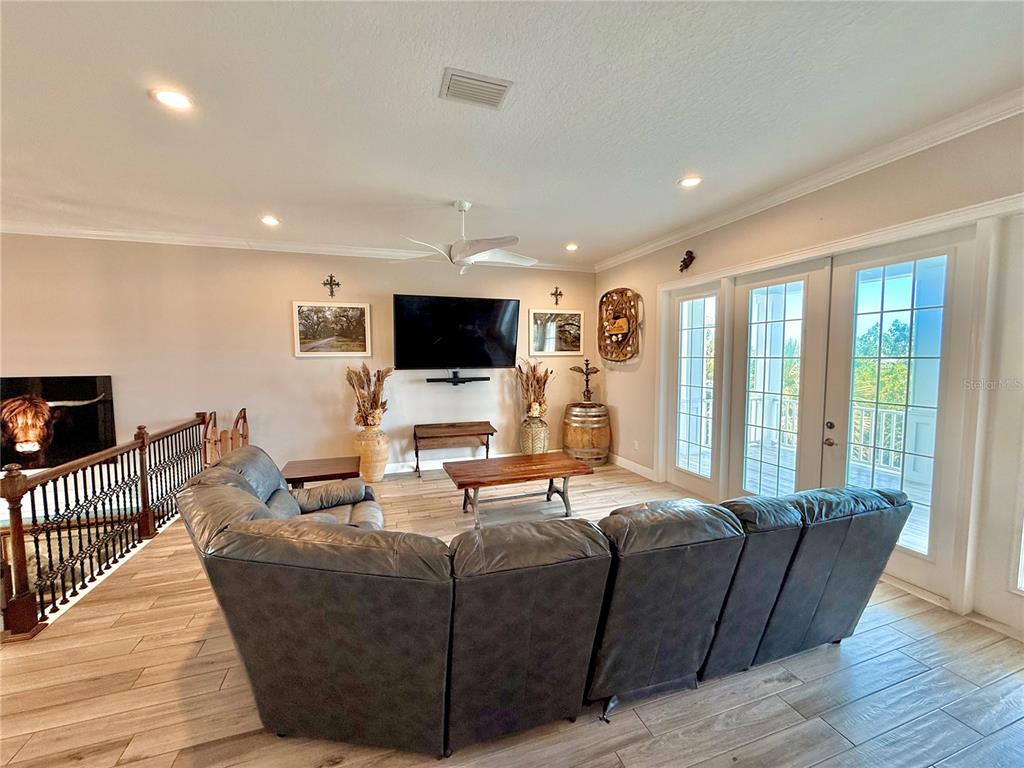 2569 Palm Avenue Flagler Beach, FL 32136 - Photo 57 of 69 a living room with furniture and a flat screen tv