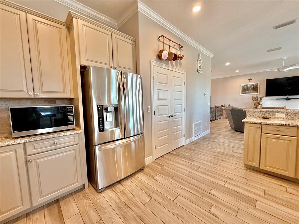 2569 Palm Avenue Flagler Beach, FL 32136 - Photo 61 of 69 a kitchen with stainless steel appliances a refrigerator stove and microwave