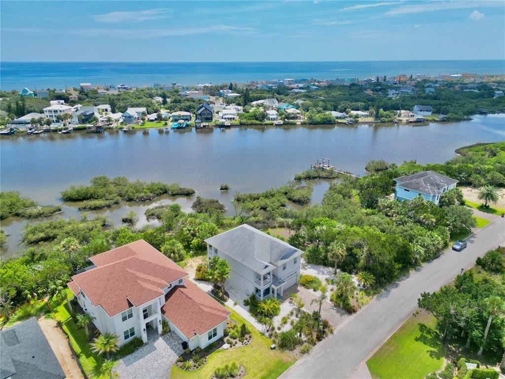 2569 Palm Avenue Flagler Beach, FL 32136 - Photo 66 of 69 an aerial view of residential houses with outdoor space and lake view