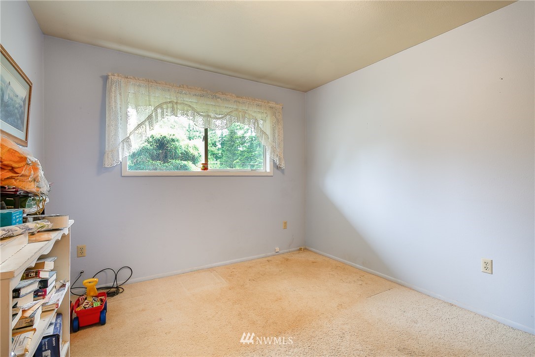 495 West Badger Road Lynden, WA 98264 - Photo 14 of 28 a view of a room with gym equipment and a window