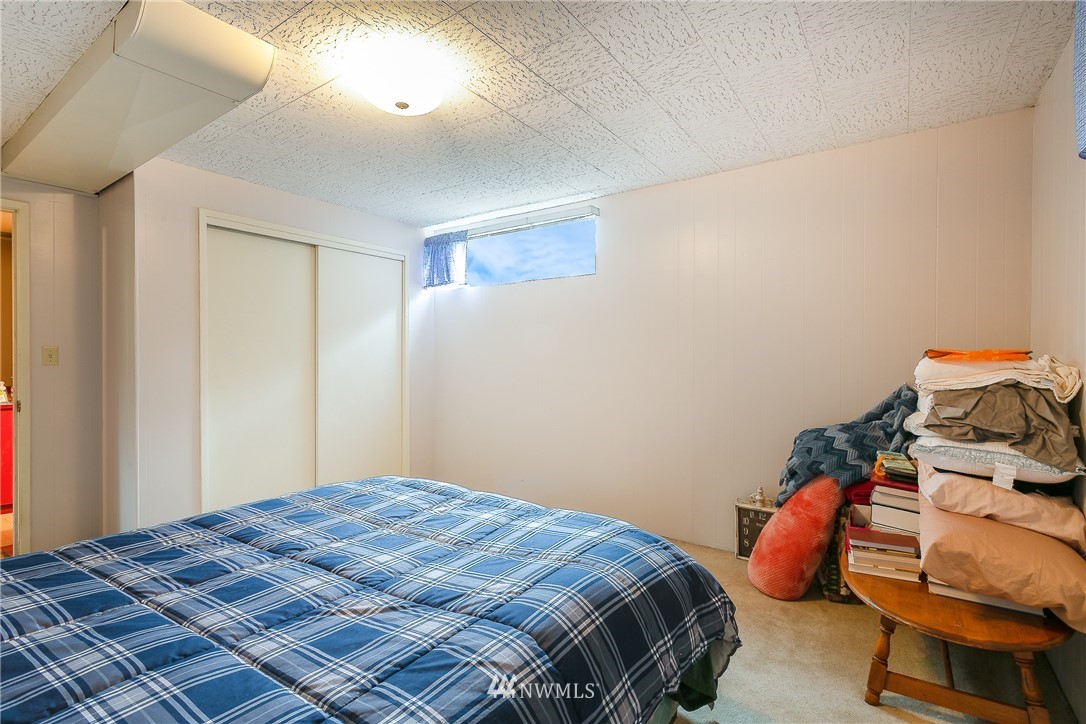 495 West Badger Road Lynden, WA 98264 - Photo 17 of 28 a bedroom with a bed and a window