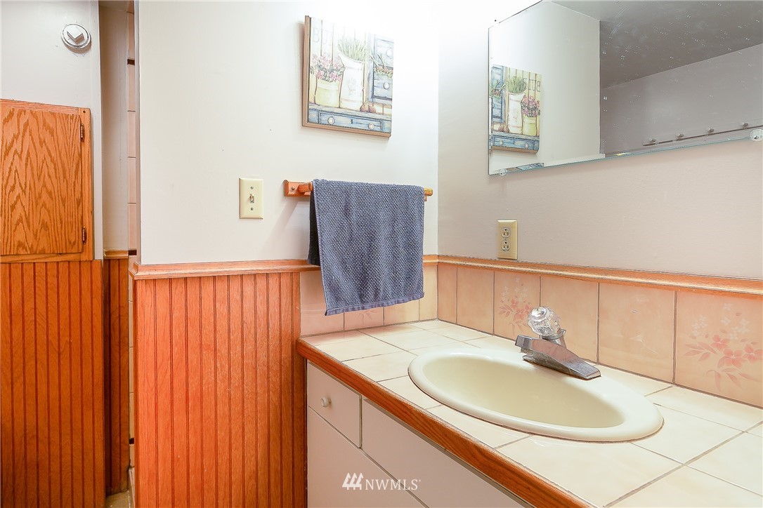 495 West Badger Road Lynden, WA 98264 - Photo 19 of 28 a bathroom with a sink and a mirror