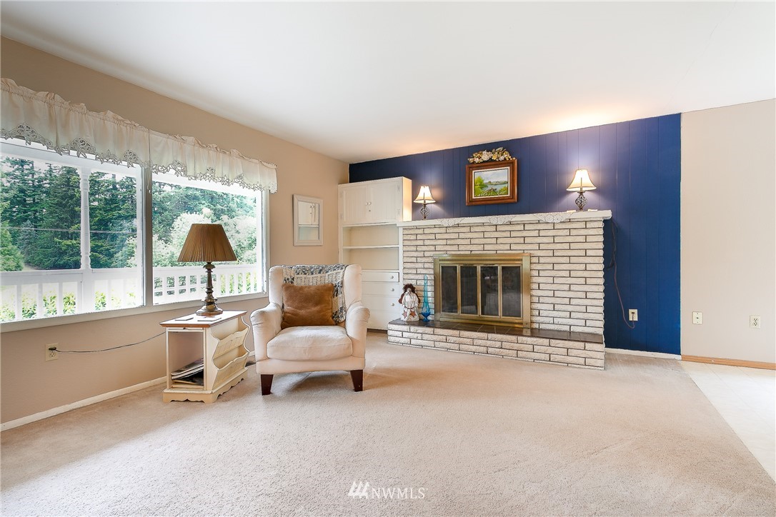 495 West Badger Road Lynden, WA 98264 - Photo 3 of 28 a living room with furniture and a fireplace