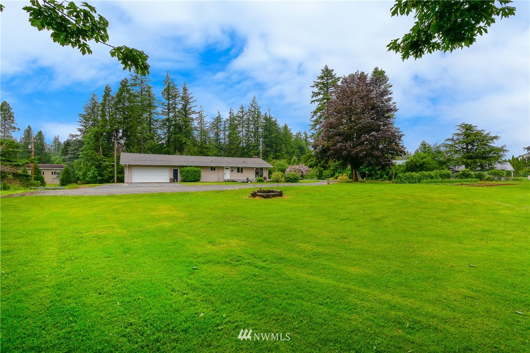 495 West Badger Road Lynden, WA 98264 - Photo 25 of 28 a house view with a garden space