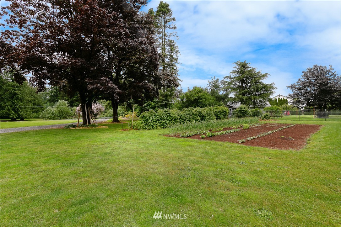 495 West Badger Road Lynden, WA 98264 - Photo 27 of 28 a view of outdoor space with garden and trees