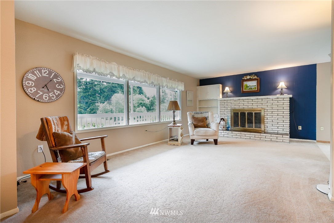 495 West Badger Road Lynden, WA 98264 - Photo 4 of 28 a living room with furniture and a fireplace