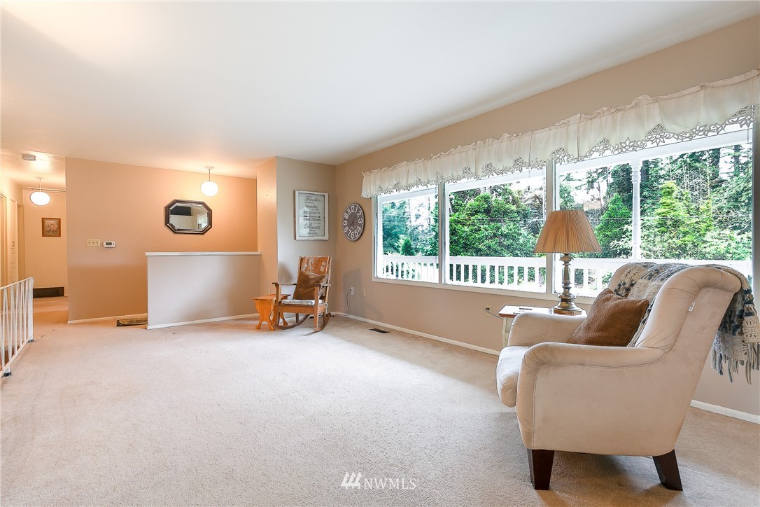 495 West Badger Road Lynden, WA 98264 - Photo 5 of 28 a living room with furniture and a large window