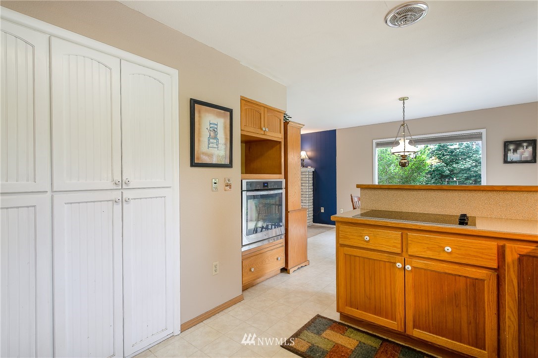 495 West Badger Road Lynden, WA 98264 - Photo 9 of 28 a kitchen with stainless steel appliances granite countertop a refrigerator and a sink
