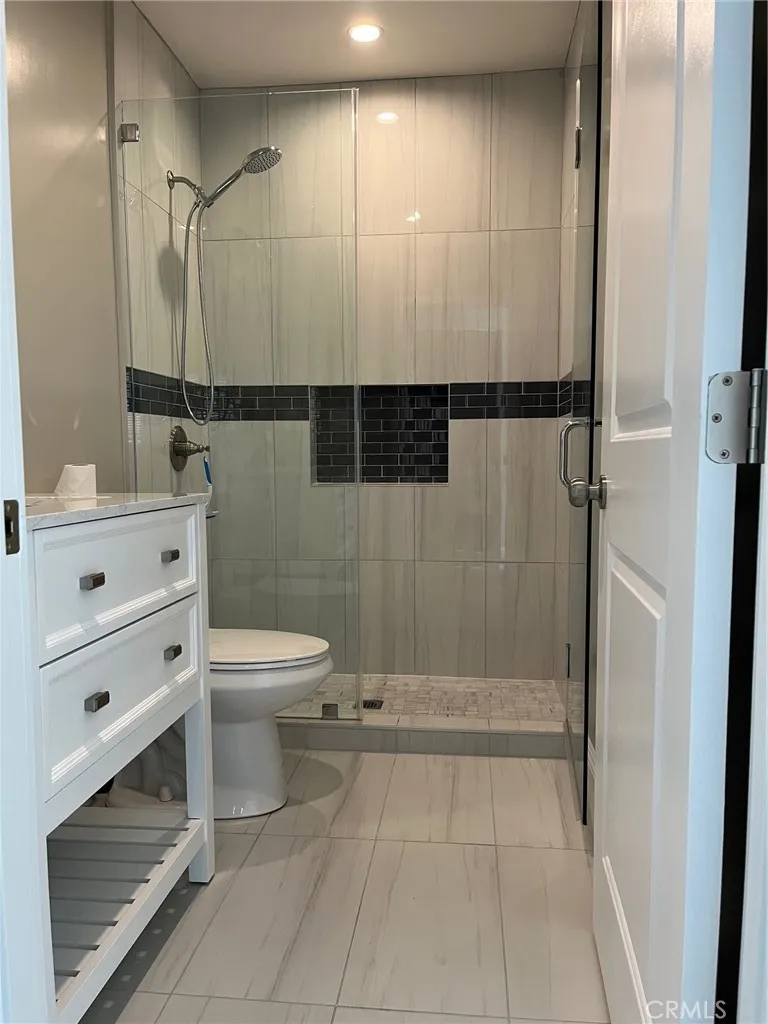 515 Alexander Street Glendale, CA 91203 - Photo 14 of 15 a bathroom with a toilet a sink and shower