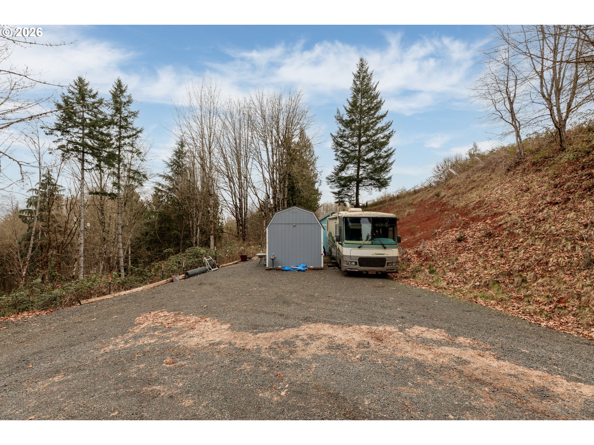 0 Debast Road Rainier, OR 97048 - Photo 4 of 12 a house with trees in the background