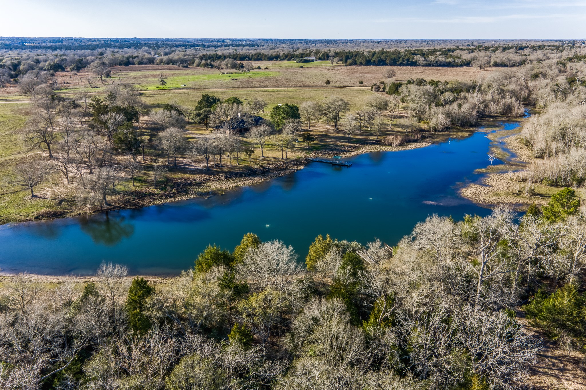 23032 Oak Road New Ulm, TX 78950 - Photo 18 of 44 a view of a lake with a mountain view