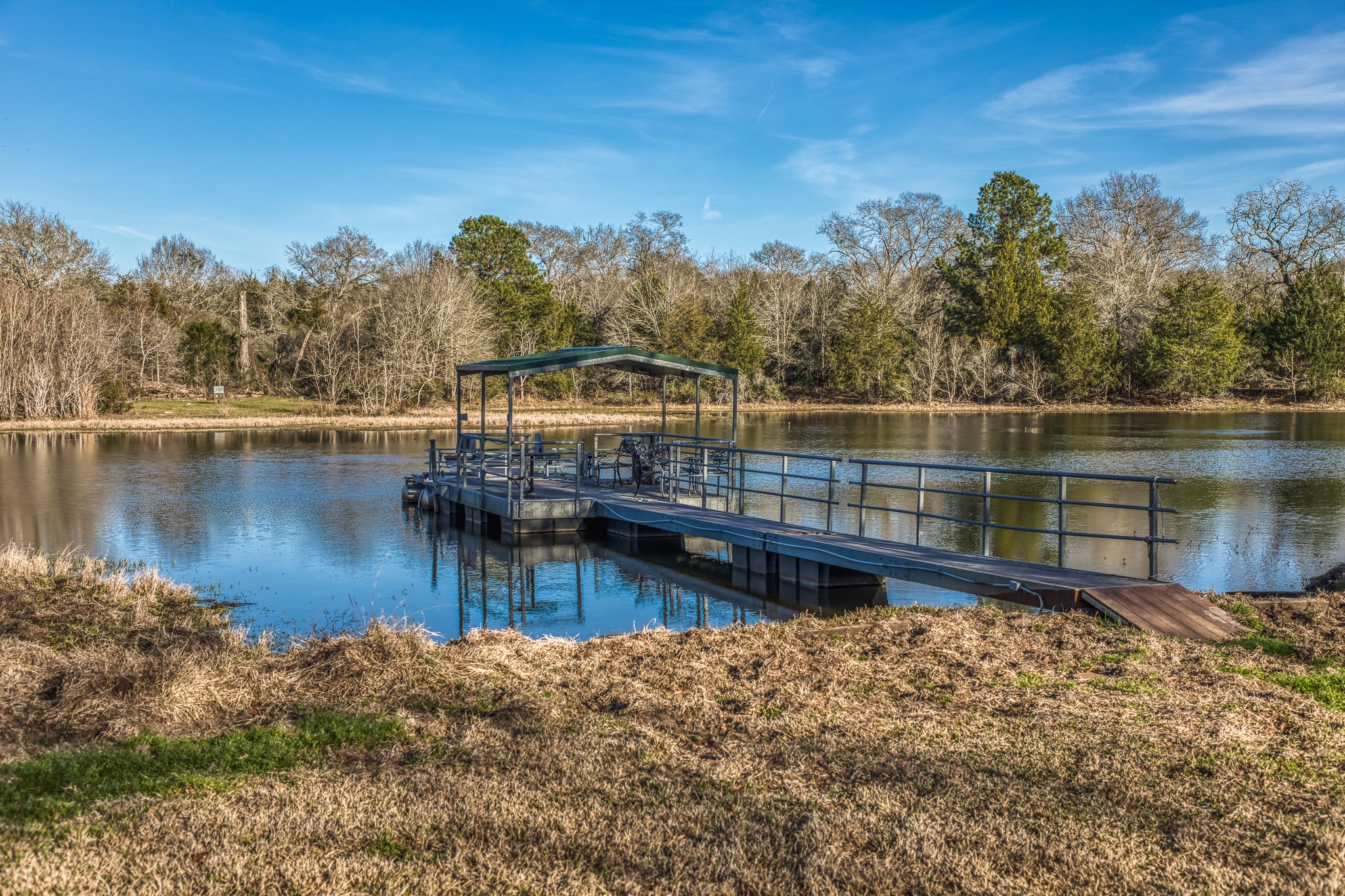 23032 Oak Road New Ulm, TX 78950 - Photo 20 of 44 a view of a lake with trees by side of house