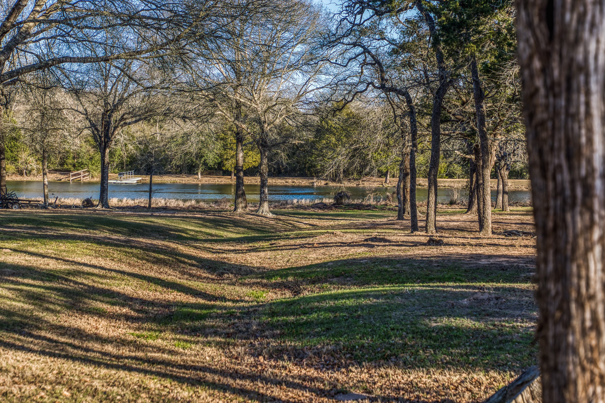 23032 Oak Road New Ulm, TX 78950 - Photo 27 of 44 a swimming pool with wooden fence