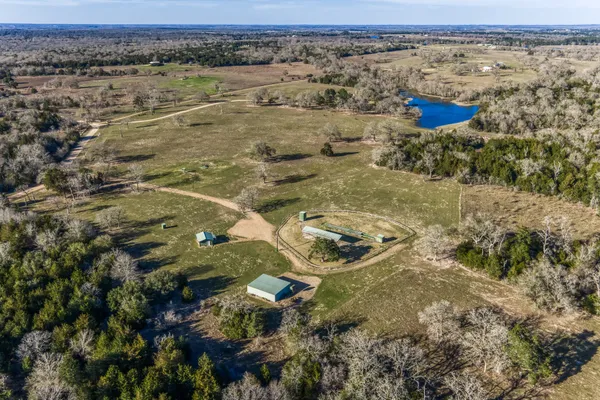 a view of a swimming pool with a yard