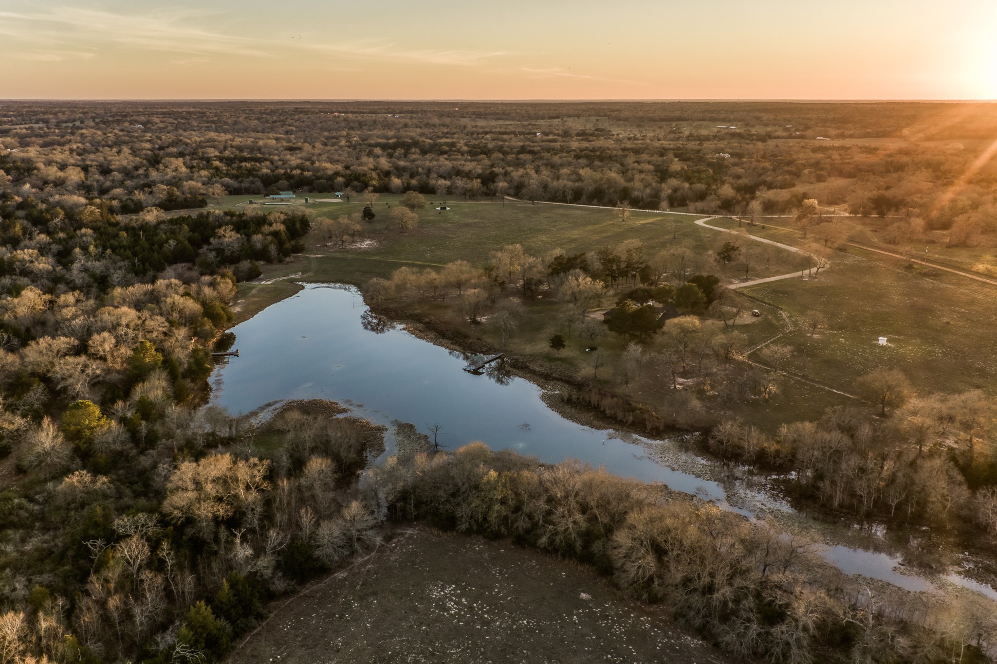 23032 Oak Road New Ulm, TX 78950 - Photo 4 of 44 an aerial view of residential house with beach and trees around