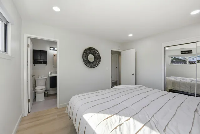 a bathroom with a sink toilet tub and shower