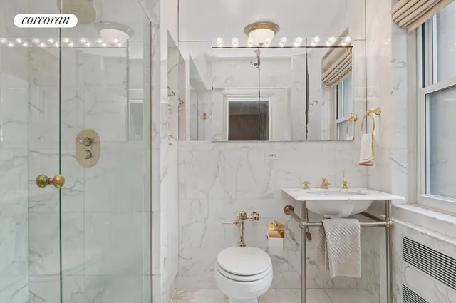 a bedroom with a large bed and a lamp on table