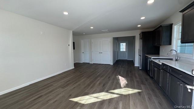 135 Cooper Road, Unit 1 Fishkill, NY 12524 - Photo 3 of 12 Kitchen featuring dark wood-type flooring and sink