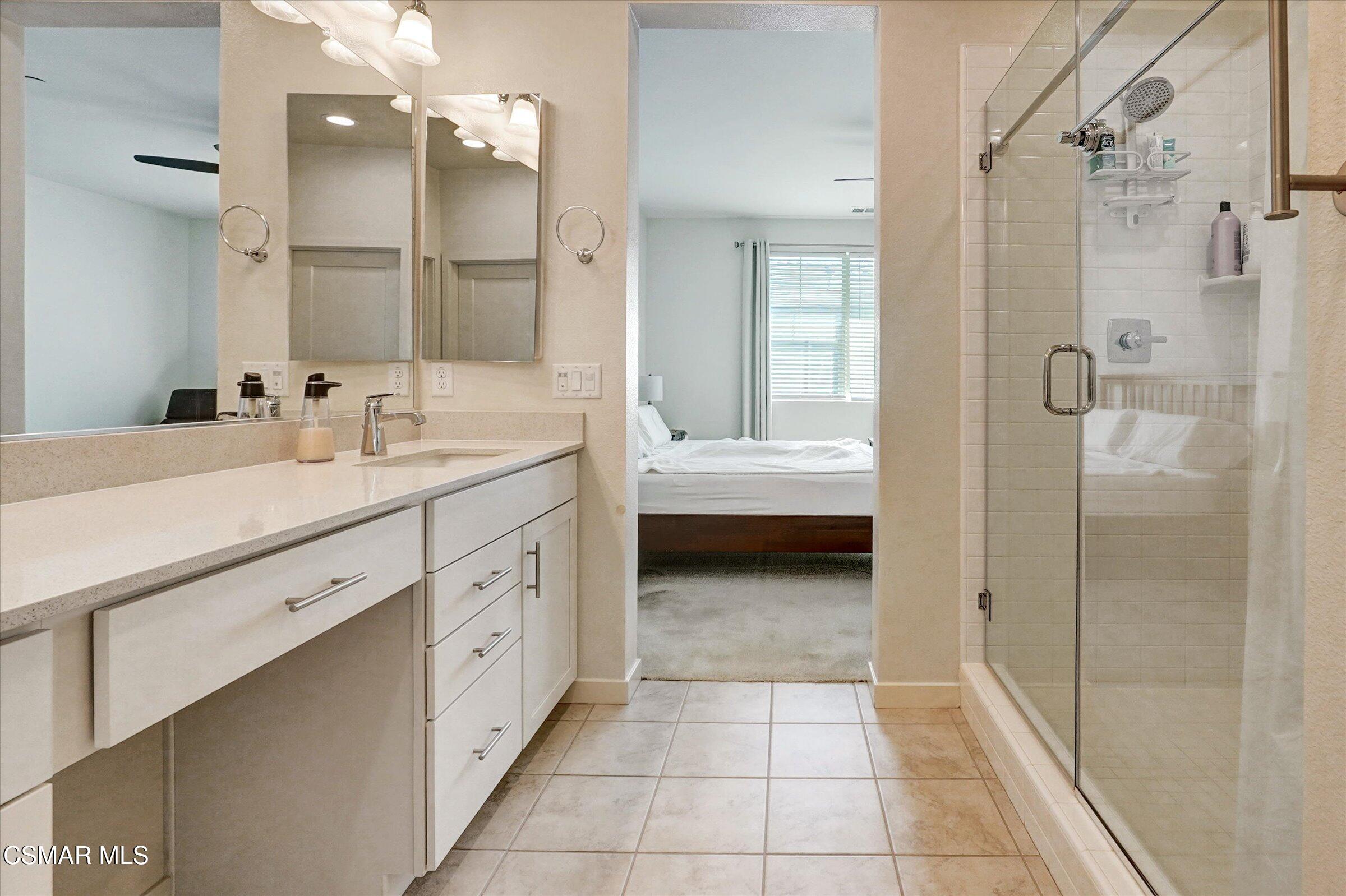 310 Farmhouse Drive, Unit 4 Simi Valley, CA 93065 - Photo 15 of 29 a spacious en suite bathroom with a double sink shower and a mirror