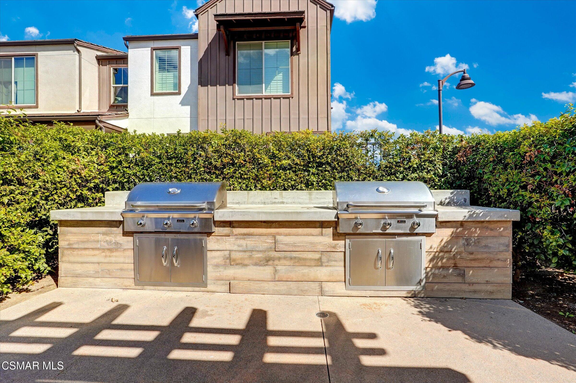 310 Farmhouse Drive, Unit 4 Simi Valley, CA 93065 - Photo 23 of 29 a backyard of a house with outdoor seating