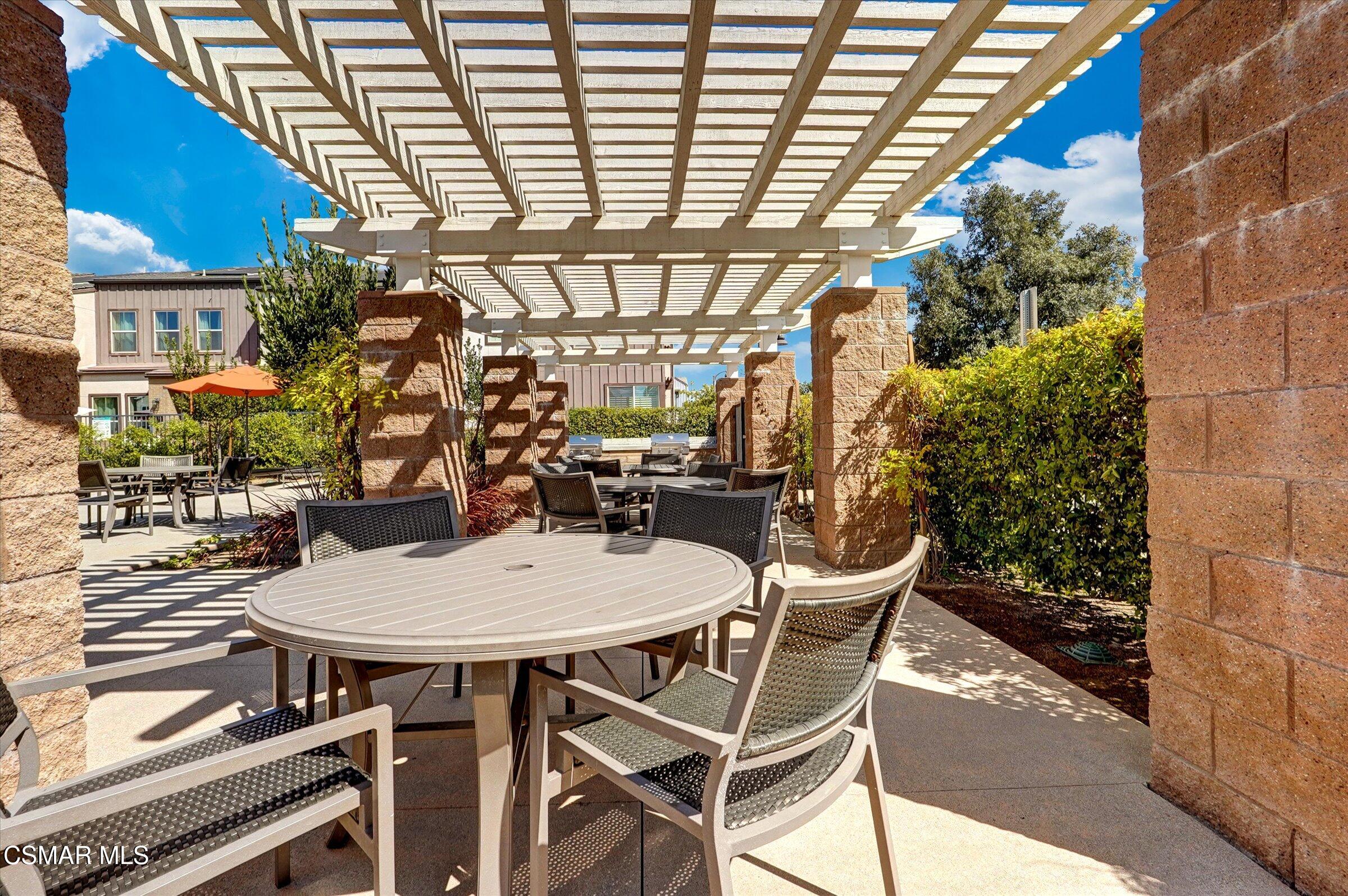 310 Farmhouse Drive, Unit 4 Simi Valley, CA 93065 - Photo 25 of 29 a view of a chairs and table in the patio