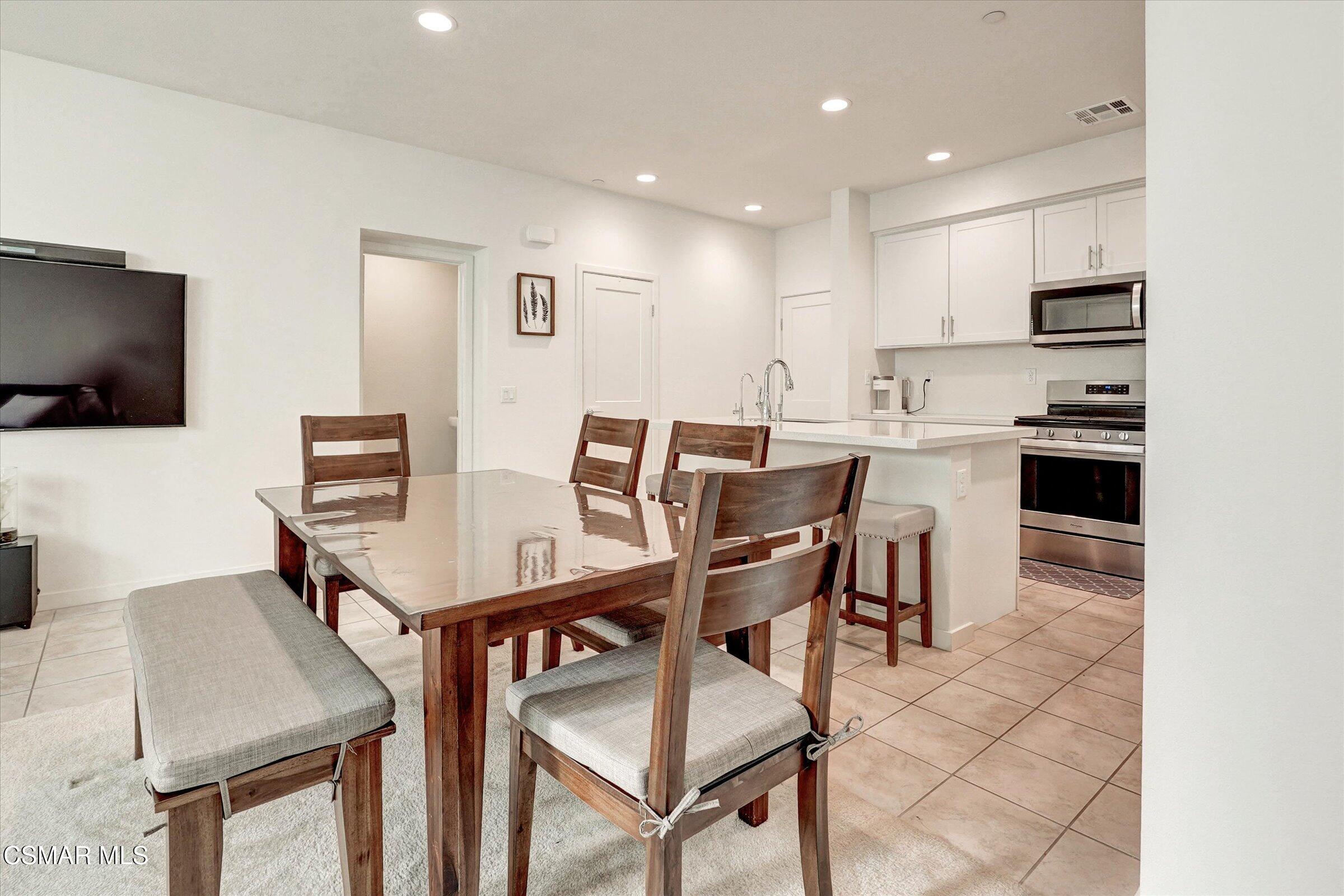 310 Farmhouse Drive, Unit 4 Simi Valley, CA 93065 - Photo 8 of 29 a view of a dining room with furniture