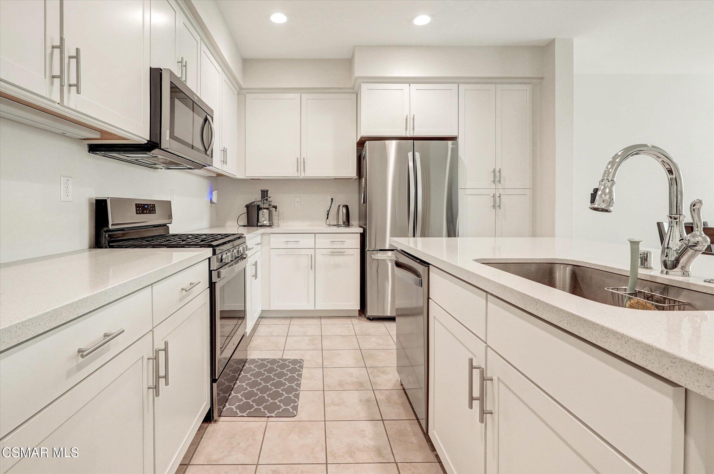 310 Farmhouse Drive, Unit 4 Simi Valley, CA 93065 - Photo 9 of 29 a kitchen with a sink cabinets and appliances