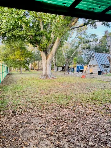 a view of a yard with an outdoor space