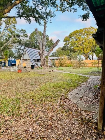 a view of a yard with an ocean view