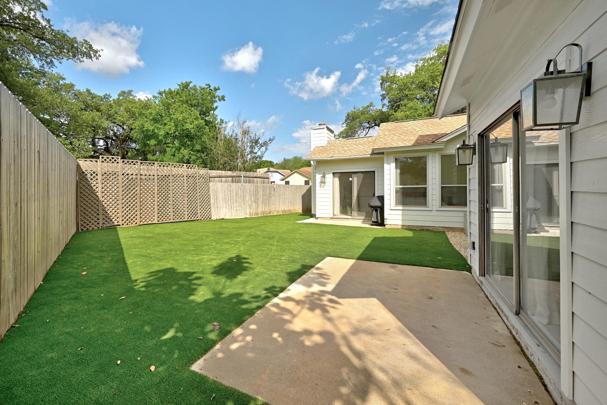 5807 Convict Hill Road Austin, TX 78749 - Photo 23 of 27 Enjoy outdoor living in the private and quiet back yard, surrounded by fully turfed lawn and fencing. Ideal for dining, relaxing, or play.