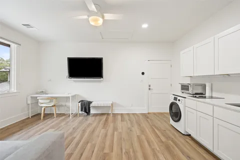 a bedroom with a large bed and a large window