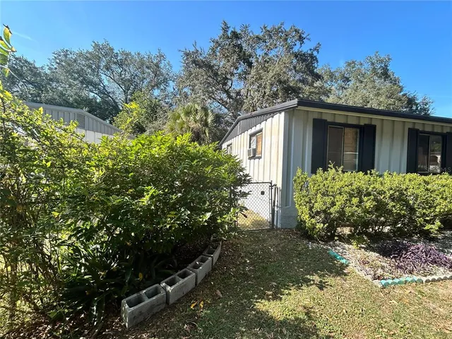 a backyard of a house with lots of green space