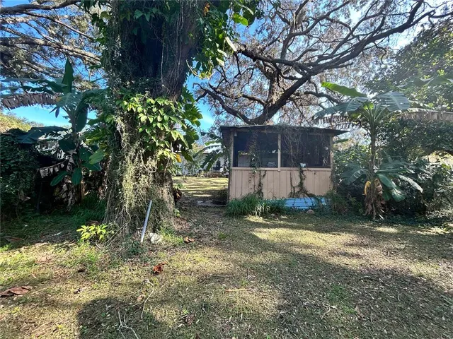 a living room with furniture a flat screen tv and a window
