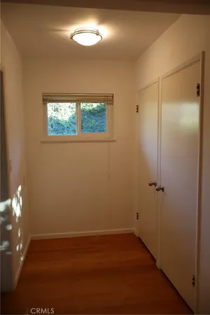 a view of empty room with brick walls