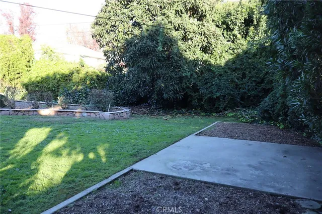 a view of a back yard of the house and car parked